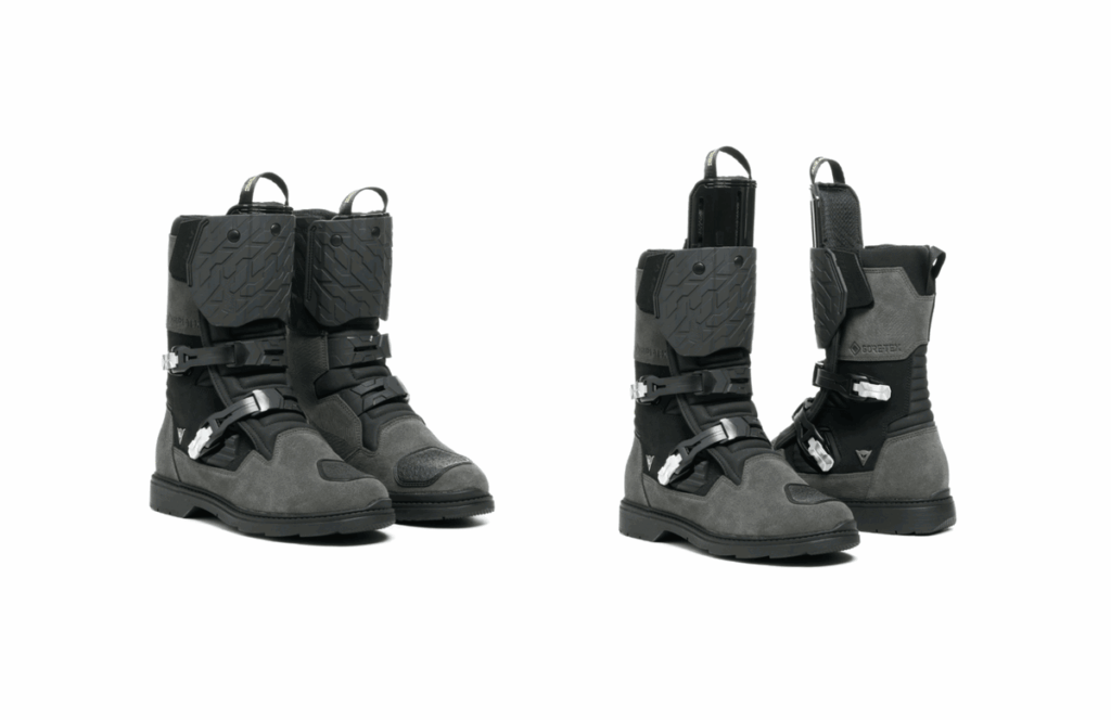 Par de botas Dainese Overyond XT GTX em destaque, mostrando o inovador sistema de proteção de canela ajustável, design robusto e membrana Gore-Tex.