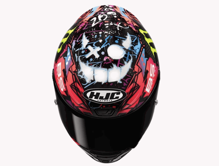 Capacete HJC RPHA 1N Funky Diablo réplica de Fabio Quartararo, exibindo gráficos vibrantes e cores contrastantes em design arrojado, com detalhes aerodinâmicos e entradas de ar de alta performance.