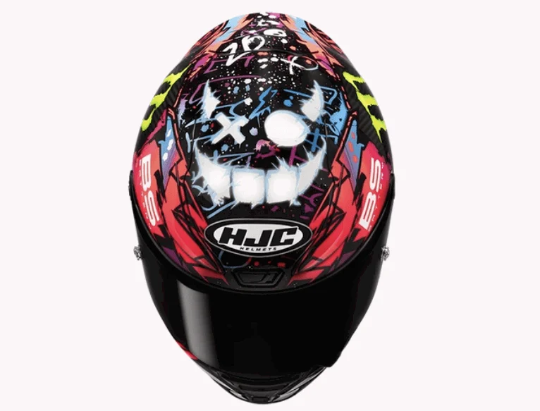 Capacete HJC RPHA 1N Funky Diablo réplica de Fabio Quartararo, exibindo gráficos vibrantes e cores contrastantes em design arrojado, com detalhes aerodinâmicos e entradas de ar de alta performance.