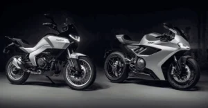 Duas motocicletas Norton, a esportiva Manx R e a roadster Atlas, lado a lado, exibindo seu design moderno e as inovações de engenharia.