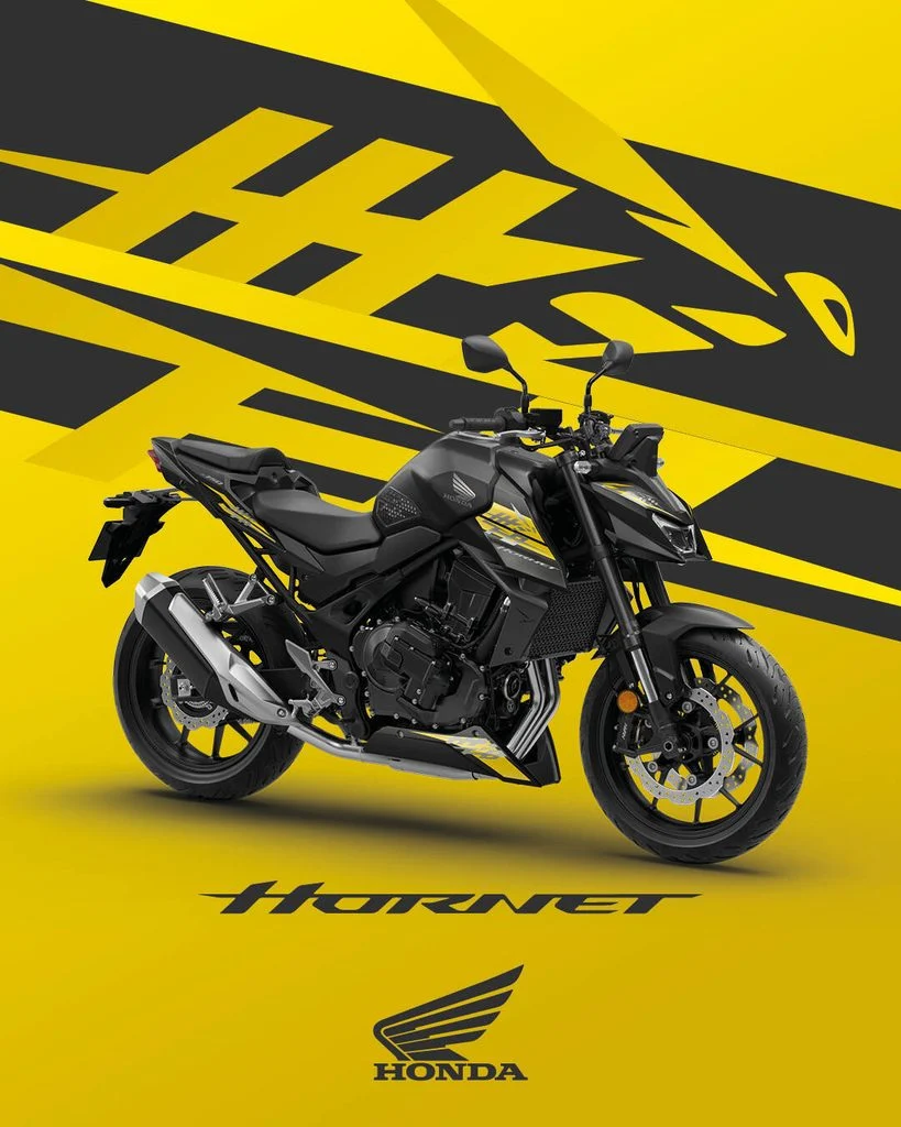 Honda CB750 Hornet 2027 com a nova combinação de cores Prata Mat Beta Metallic e Cinza Iridium Metallic, destacando seu design agressivo e farol duplo LED.